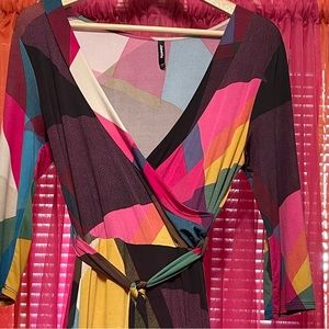 Janette, abstract print, medium maxi dress. Deep v-neck, arm length to elbow.